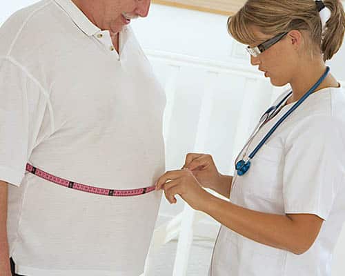 Radiofrequency handpiece moving across the abdomen in Glasgow